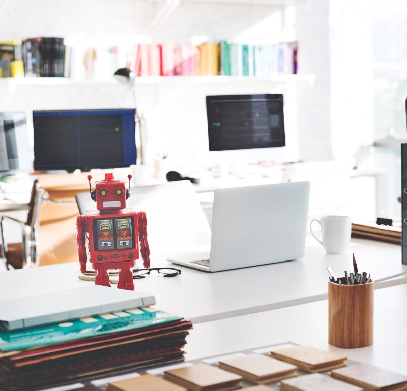 robot in office with computers