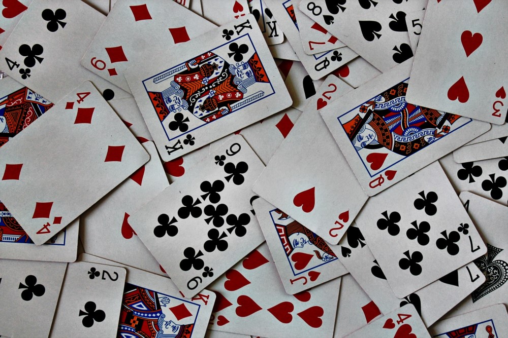deck of cards thrown randomly down