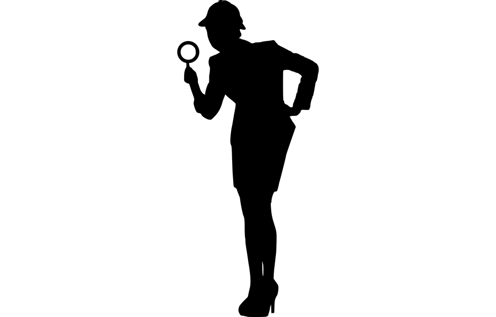 Woman with detective hat and magnifying glass